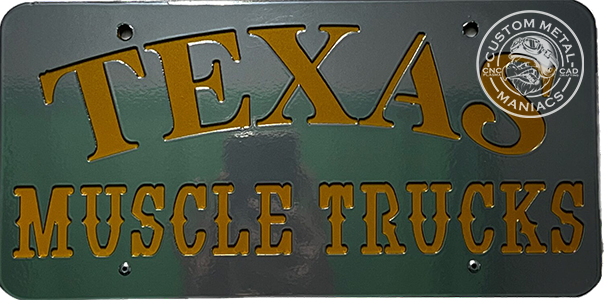 Custom metal license plate, gold text on green, reading "Texas Muscle Trucks"